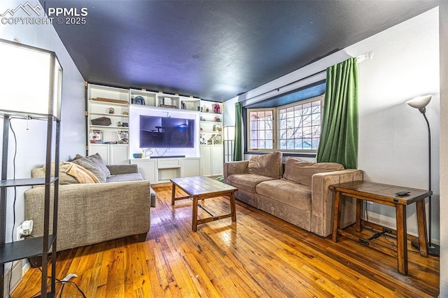 home theater with wood-type flooring