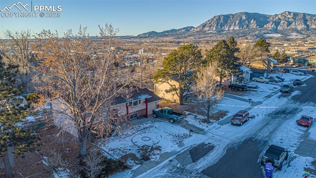 2841 Pinnacle Dr, Colorado Springs, CO 80910 - snowy aerial view with a mountain view