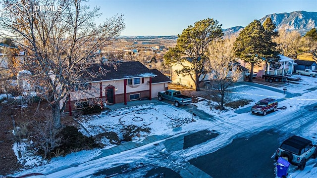 2841 Pinnacle Dr, Colorado Springs, CO 80910 - snowy aerial view featuring a mountain view