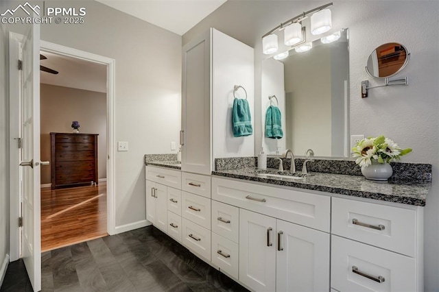 bathroom featuring hardwood / wood-style flooring and vanity