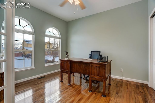 home office featuring light hardwood / wood-style flooring and ceiling fan