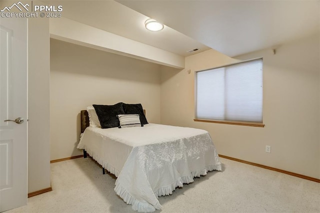 bedroom featuring carpet floors and beam ceiling