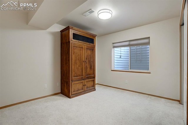 unfurnished bedroom featuring light colored carpet