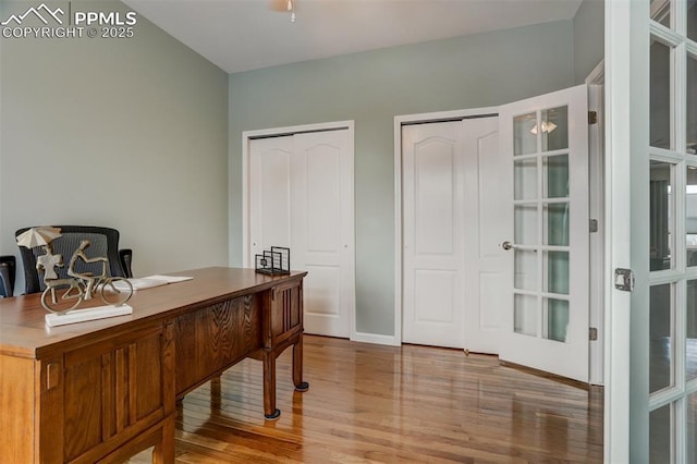 office area with hardwood / wood-style flooring