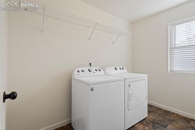 laundry area featuring washing machine and clothes dryer