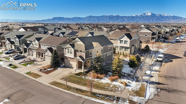 birds eye view of property with a mountain view