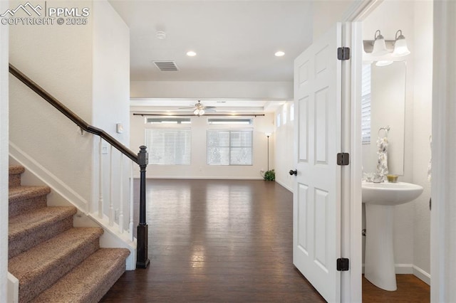 interior space with ceiling fan, dark wood-type flooring, and sink