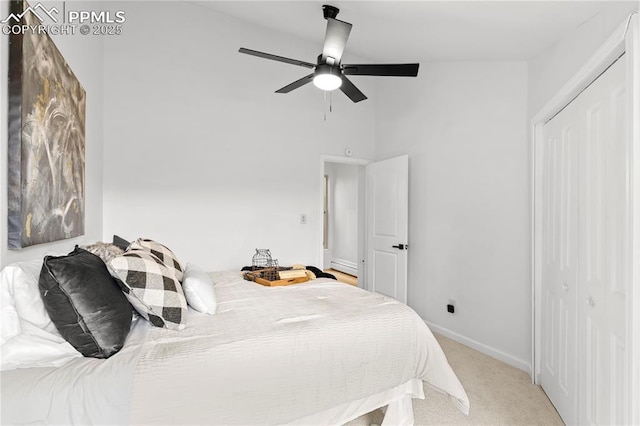 bedroom featuring ceiling fan and light carpet