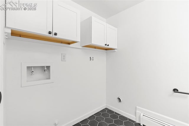 washroom with washer hookup, baseboard heating, cabinets, and hookup for a gas dryer