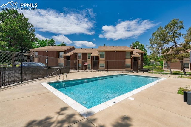 view of swimming pool with a patio