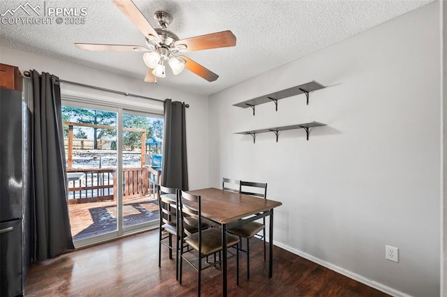 dining area featuring ceiling fan, a textured ceiling, and dark hardwood / wood-style floors