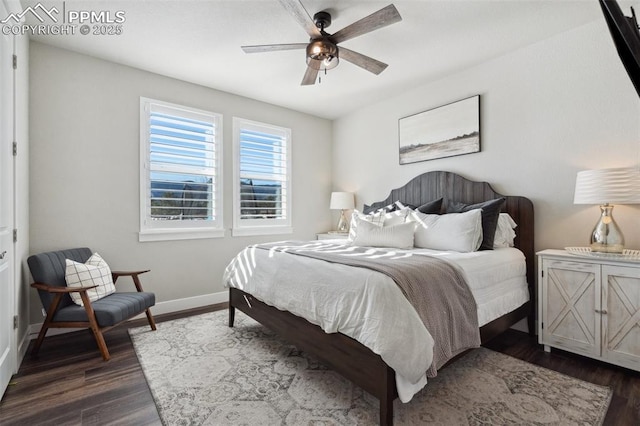 bedroom featuring dark wood-type flooring and ceiling fan