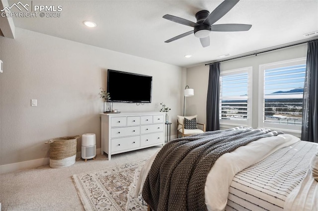 bedroom featuring light carpet and ceiling fan