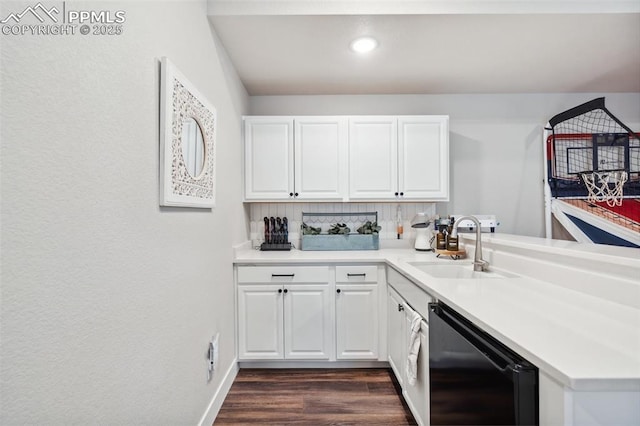 kitchen featuring sink, white cabinetry, kitchen peninsula, decorative backsplash, and beverage cooler