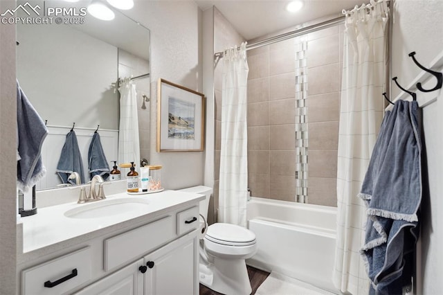 full bathroom with toilet, shower / tub combo with curtain, and vanity