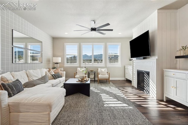 living room featuring dark hardwood / wood-style flooring and ceiling fan