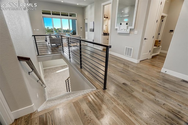 stairway featuring hardwood / wood-style flooring