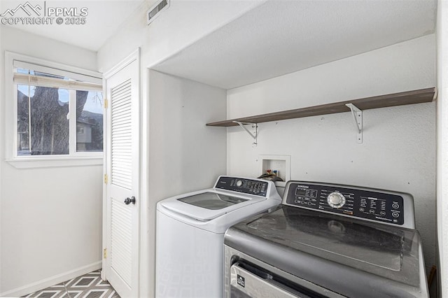 laundry room with washing machine and dryer