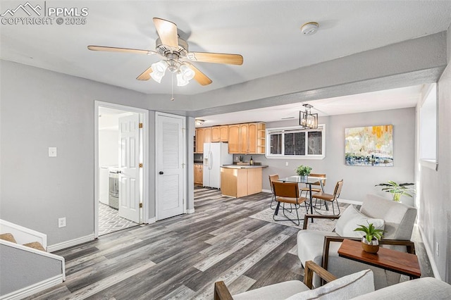 living room with hardwood / wood-style floors and ceiling fan