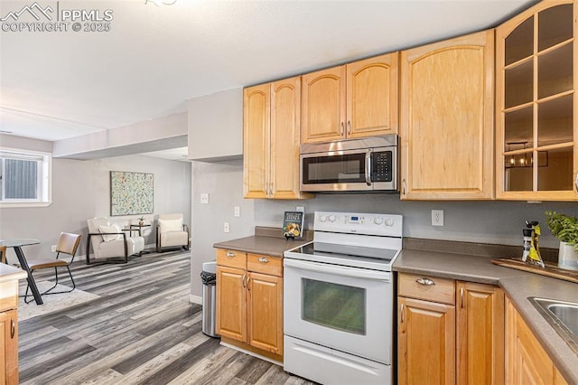 kitchen featuring dark hardwood / wood-style floors, sink, light brown cabinetry, and white range with electric cooktop