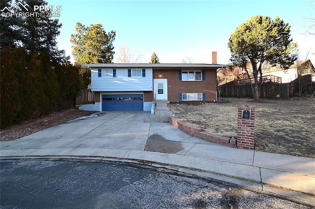 bi-level home featuring a garage