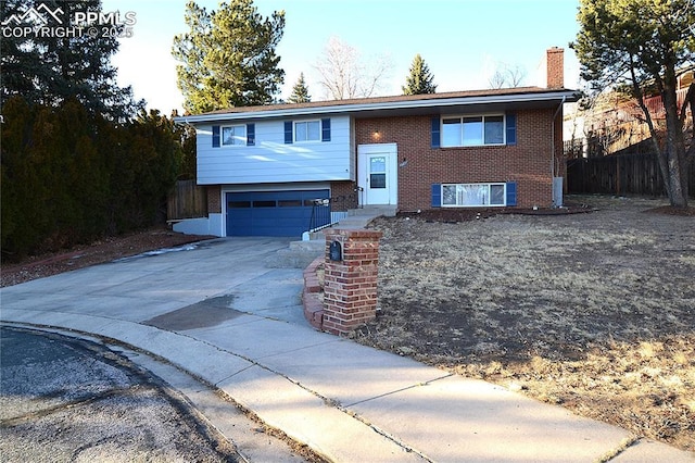 bi-level home featuring a garage