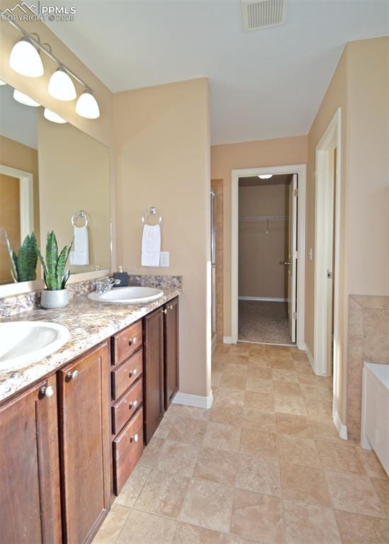 bathroom featuring vanity and plus walk in shower