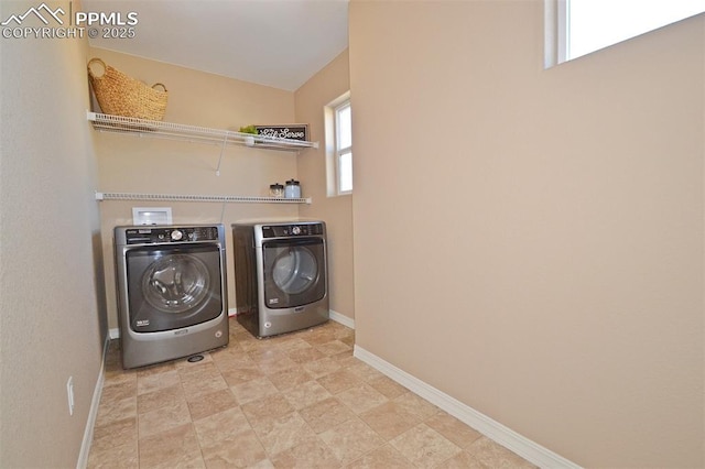 washroom featuring washing machine and dryer