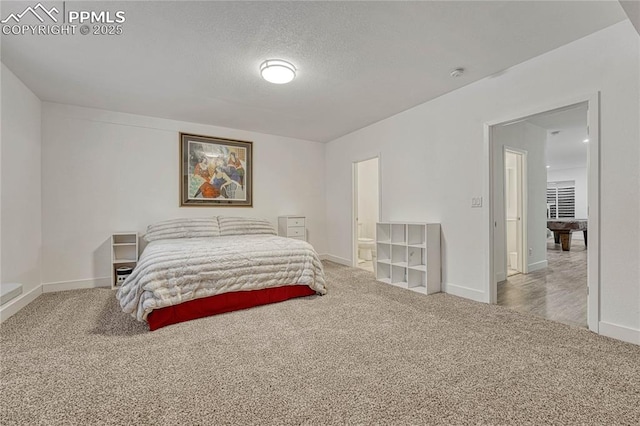 carpeted bedroom with a textured ceiling