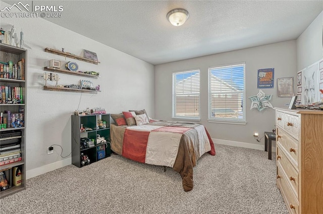 bedroom featuring light carpet and a textured ceiling