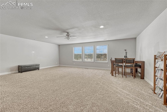 interior space featuring a textured ceiling and ceiling fan