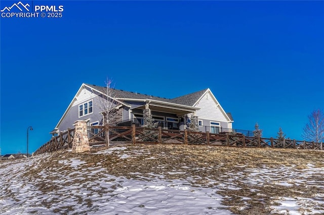 view of snow covered house