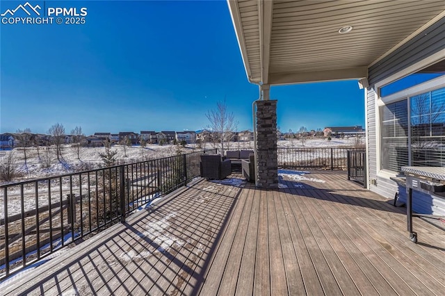 snow covered deck featuring outdoor lounge area