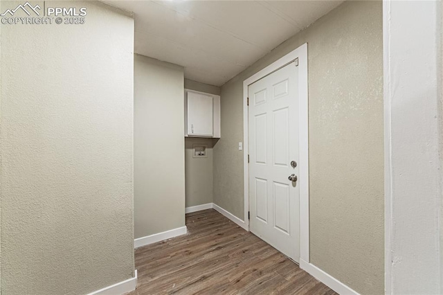 corridor with light hardwood / wood-style floors