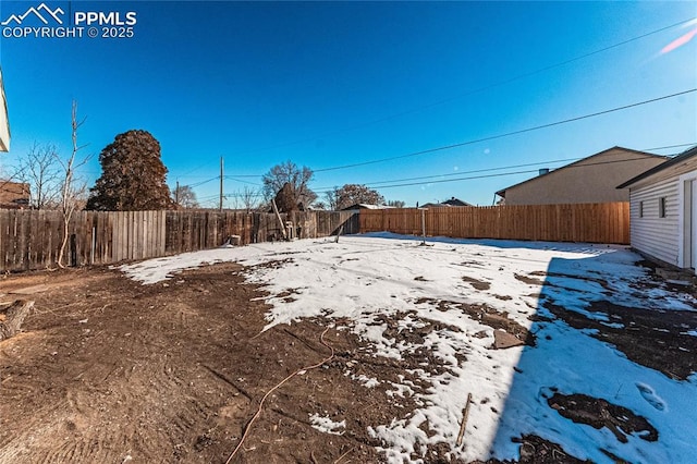 view of yard covered in snow