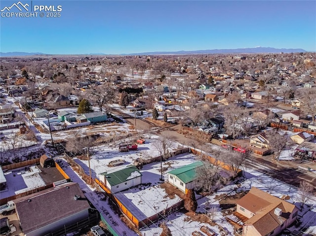 birds eye view of property with a mountain view