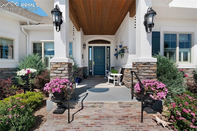 doorway to property featuring covered porch