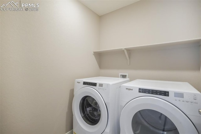 washroom with washer and clothes dryer