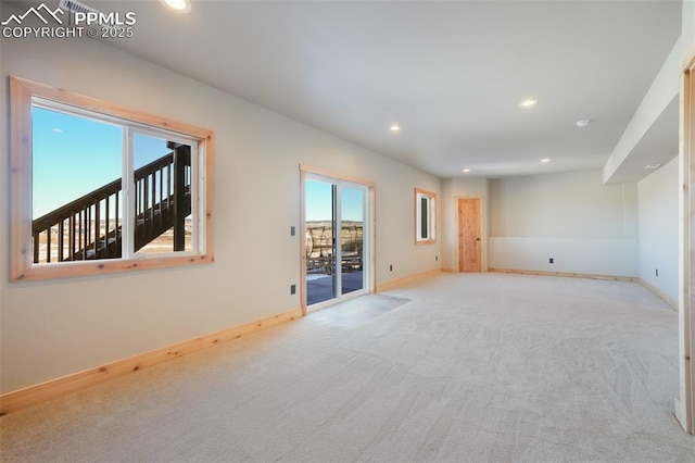 empty room featuring light carpet