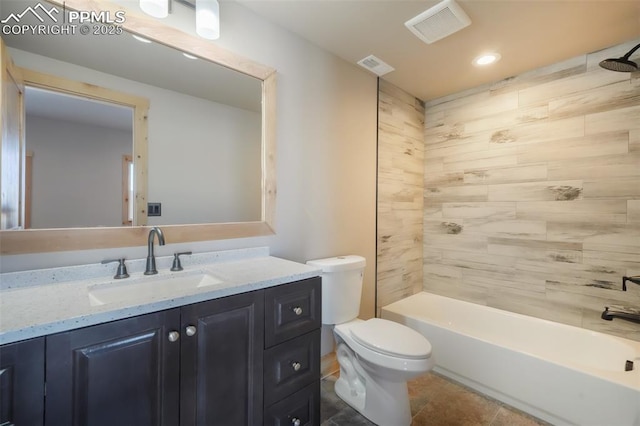 full bathroom with toilet, vanity, tiled shower / bath combo, and tile patterned flooring