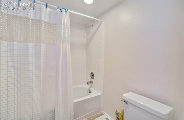 bathroom featuring toilet and shower / bathtub combination with curtain