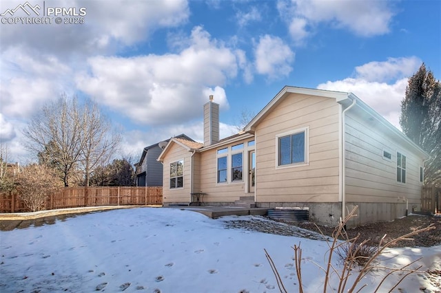 view of snow covered house