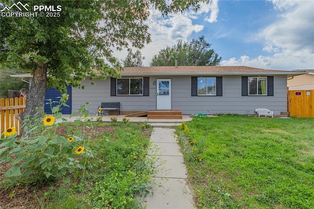 single story home featuring a front yard