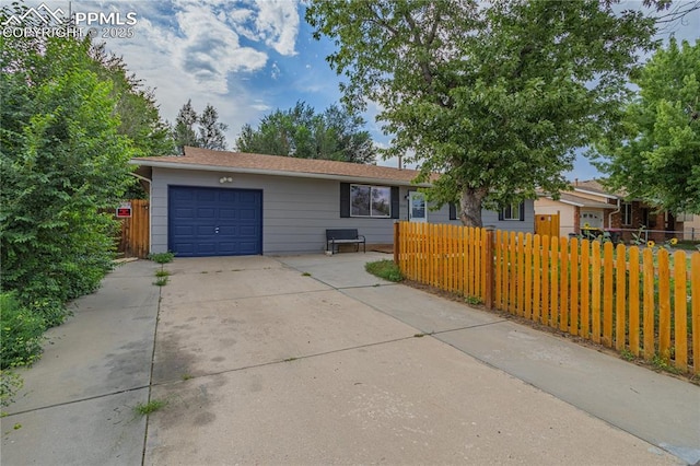 ranch-style home with a garage