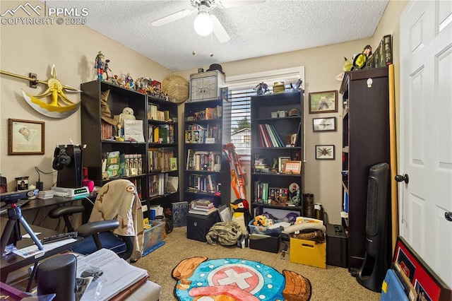 carpeted office space featuring a textured ceiling and ceiling fan