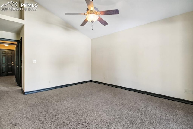 carpeted spare room featuring vaulted ceiling and ceiling fan