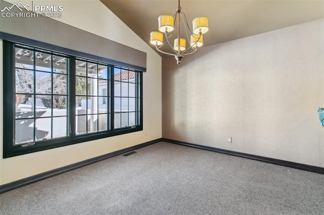 unfurnished room with an inviting chandelier, vaulted ceiling, and carpet