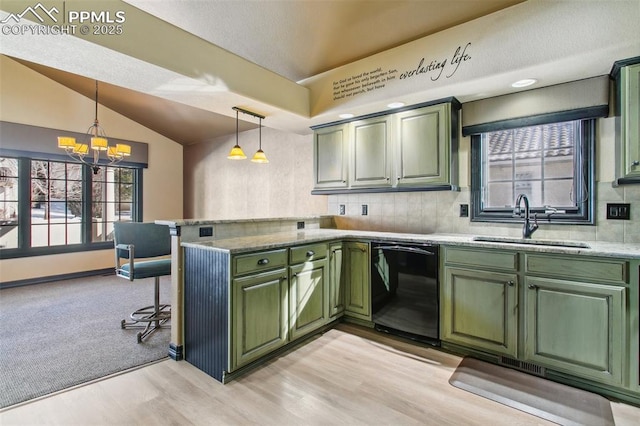 kitchen featuring decorative light fixtures, dishwasher, sink, green cabinets, and kitchen peninsula