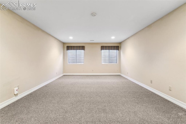 unfurnished room with carpet flooring