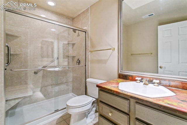 bathroom with vanity, toilet, an enclosed shower, and tile patterned flooring